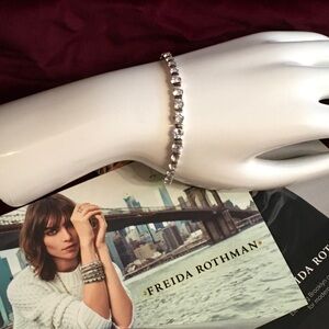 Sterling silver bracelet with hand set cz stones. Size 6 3/4. Freida Rothman